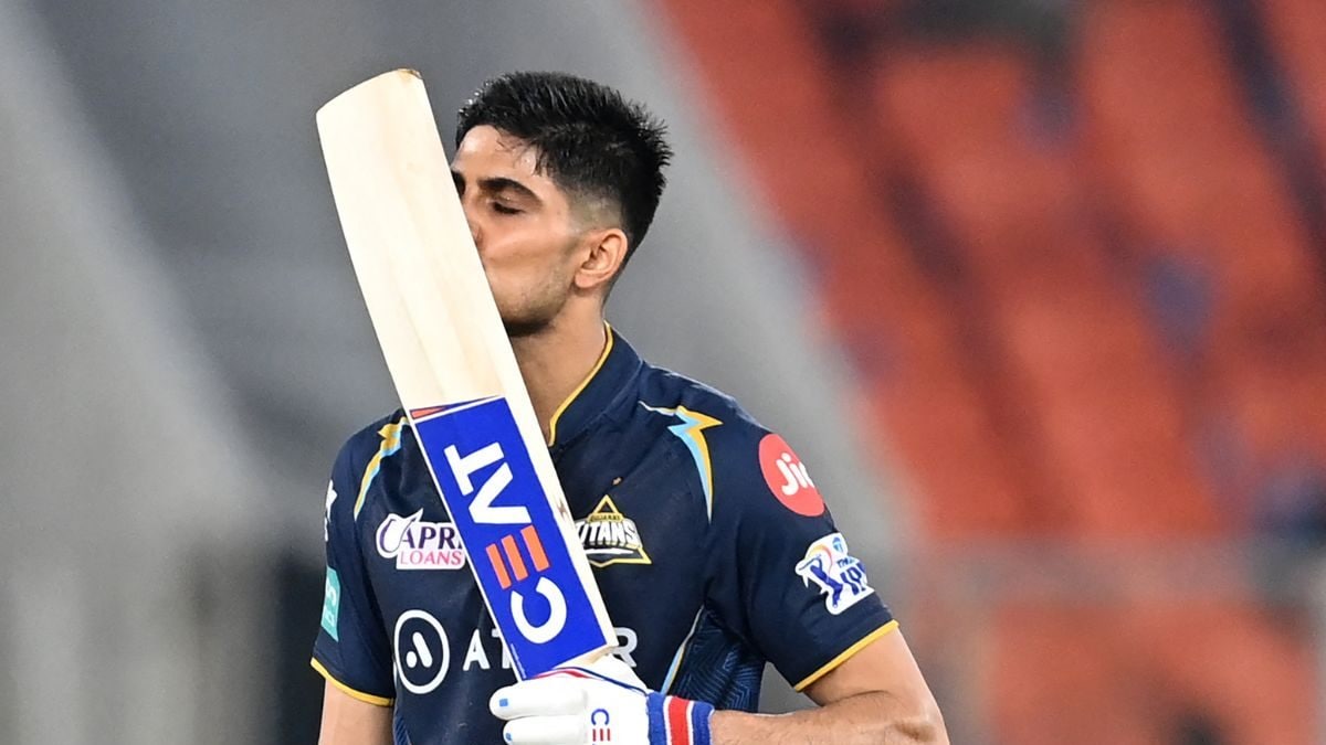 Cricketer holding a bat, focused